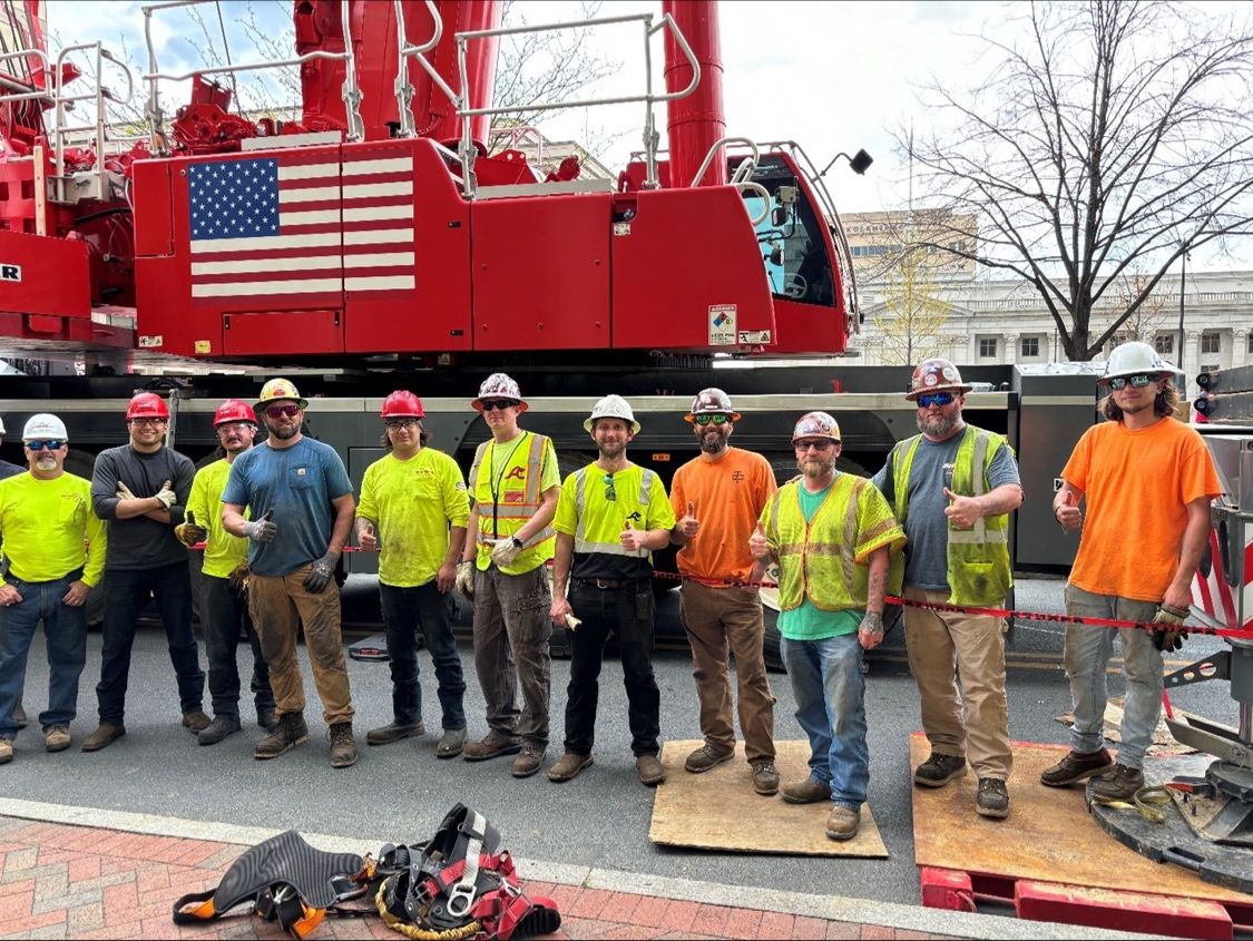 group in front of crane